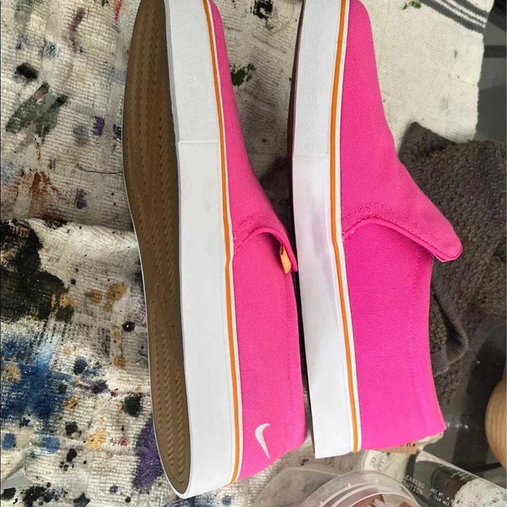 Nike slip on sneakers nwot just cleaning out the closet.